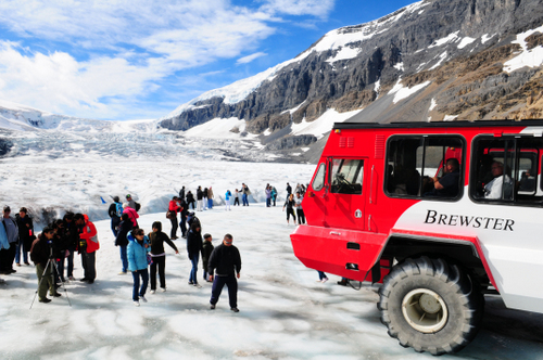 Tourists on surface of the Athabasca Glacier.