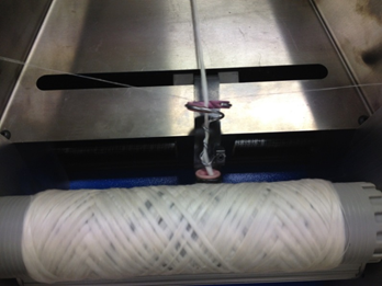 fibre threads rolled around a roller