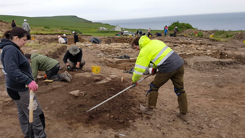 UHI Students and staff working at The Cairns excavation, South Ronaldsay.