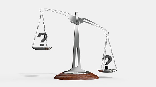Decorative image of an old fashioned scale with question marks on each side